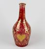 A 19th century gilt red glass bottle. Possibly 19th century, Ottoman Turkish, of Beykoz style having