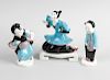 A group of three Royal Worcester Chinese figures, comprising a kneeling female number 3397, plus two