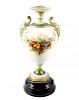 A large Royal Worcester porcelain twin handled vase, the ovoid shaped body upon a moulded plinth bas
