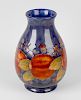 A Moorcroft pottery Pomegranate and Berry pattern vase Circa 1950, of baluster form, with tube-lined