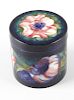 A Moorcroft pottery Anemone pattern jar and cover Of cylindrical form, the flat circular cover and t