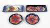 Four items of Moorcroft pottery. Comprising: two small shallow Clematis pattern circular dishes, the