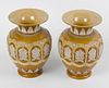 A pair of Doulton Lambeth silicone ware vases. Each of ovoid form with flared neck, having raised fo