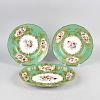 Four pieces of early 19th century Coalport-style porcelain. Comprising two serving plates of oval fo