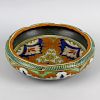 A Gouda pottery bowl. Of slightly lobed form decorated in orange, blue and cream glaze, the whole ra