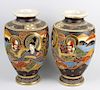 A large pair of 20th century Japanese vases. Of shouldered pear form decorated with figures before a