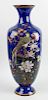A good large Japanese Meiji period cloisonne vase. The squared body with blue ground, decorated a st