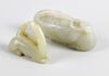 A nephrite Jade carved study of a crane, the head turned back and resting upon the body grasping a s