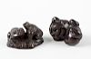 Two Japanese hardwood netsuke. The first modelled with two toads on a lily pad, 1.75, (4.75 cm) long