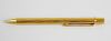 A Must de Cartier 22ct gold ballpoint pen. The ribbed body with plain clip having Cartier emblem, 5