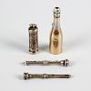 Four assorted propelling pencils. Comprising: a novelty champagne bottle stamped W. S. HICKS, 1.75,