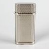 A Cartier silver-plated lighter with textured finish, 2.5 (6cm). <br><br>Minor wear to body, includi