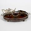 An Edwardian silver miniature tea service and tray. Comprising reeded oval teapot,1.9(4.8cm) long, a