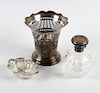 A small group of silver items. Comprising a pair of silver lidded toiletry jars with initialled hing