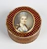 A 19th century French inlaid horn patch box The circular push-on cover centred by an oval portrait o