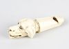 A Victorian ivory whistle, modelled as the head of a dog with open mouth and inset eyes, 3.1, (8cm)