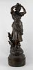 A large spelter figure Circa 1900, modelled as a maiden arranging flowers in her hair, cast 'M.M.S 8