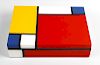 A Mondrian trust lacquered desk box. The rectangular cover decorated in bold geometric design in the