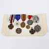 A group of assorted German badges and medals. To include World War I and Third Reich examples, (9).