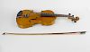 An early 20th century inlaid violin. The reverse having mother-of-pearl inlaid interlocking motif, a