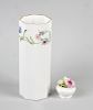A box containing a Royal Worcester bone china vase, the white glazed ground transfer decorated in th