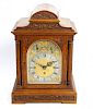 A good late 19th century oak-cased triple fusee bracket or table clock The 6.5-inch arched brass dia