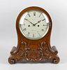 A Victorian carved walnut twin fusee bracket clock The 7.5-inch cream-painted convex Roman dial insc