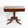 A 19th century mahogany fold over topped card table. The inlaid and cross banded rectangular top wit