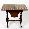 A mid Victorian inlaid walnut fold over games/work table. the figured quarter veneered top with cent