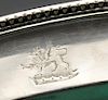 A George III silver meat dish by Paul Storr, the oval form with dual crests, raised edge with beaded