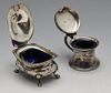 A Victorian silver open salt of cauldron shape with beaded rim above engraved floral swags, missing