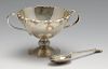 An early twentieth century Irish cased silver bowl and spoon, the conical bowl with applied scroll r