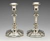 A pair of early twentieth century silver candlesticks in early Georgian style, each octagonal sided