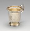 A modern silver cup, of plain form having engraved initials and date, with capped scrolling handle a