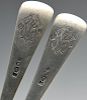 A set of four Dutch silver table spoons, the reverse terminals with monogram engravings. Together wi