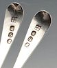 A pair of George III silver condiment spoons, having initialled terminals and gilt bowls. Hallmarked