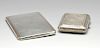 A 1920's silver cigarette case of rounded rectangular form, having foliate scroll engraving througho