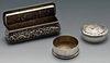 A late Victorian small silver box of oblong form, ornately embossed with floral and foliate scrolls