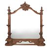 A carved wood wall mirror
