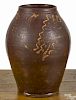 Pennsylvania redware jar, early 19th c., with slip decorated tulip with dot accents, 10'' h.