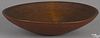 Turned and painted wood bowl, 19th c., retaining an old red surface, 12 1/4'' dia.