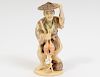 CARVED IVORY FIGURE OF A FISHERMAN