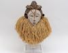 AFRICAN TRIBAL CARVED AND PAINTED MASK WITH RAFFIA