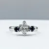 Marquise Cut Diamond & Sapphire Three-Stone Engagement Ring