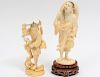 TWO CARVED IVORY FIGURES WITH FISH