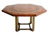 Guy Lefevre for Maison Jansen Dining Table, having burled veneer book matched in a geometric concentric pattern set on brass base, height 28.5 inches,