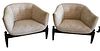Pair of Castro Convertible Bucket Chairs, having three legs with flame stitch upholstery and ebonized legs, height 24 inches, width 31 inches.