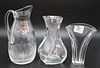 Three Piece Baccarat Group, to include two vases and a pitcher, tallest height 10 inches.