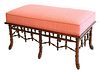 Bench with pink upholstered top over bamboo style base, height 19.5, inches, length 37.5 inches.