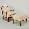 Louis XV style walnut fauteuil and ottoman